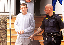 Michael Man of Russell is escorted out of provincial court at the Rossburn Community Hall by sheriffs on Wednesday after a sentencing hearing. Man, 46 was previously convicted of uttering threats and later pleaded guilty to three additional counts.