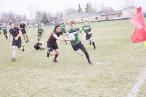 Alex Thompson tries to cut the corner on a Crocus Plains defender.