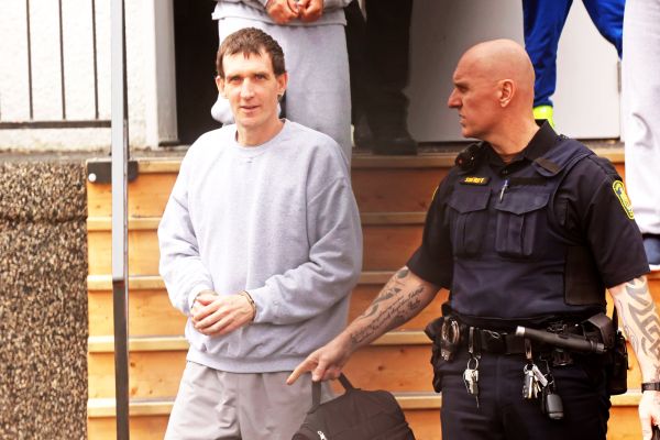 Michael Man of Russell is escorted out of provincial court at the Rossburn Community Hall by sheriffs on Wednesday after a sentencing hearing. Man, 46 was previously convicted of uttering threats and later pleaded guilty to three additional counts.